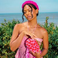 ARNOLDI Daisy Pochette perlée à la main en rose et rouge