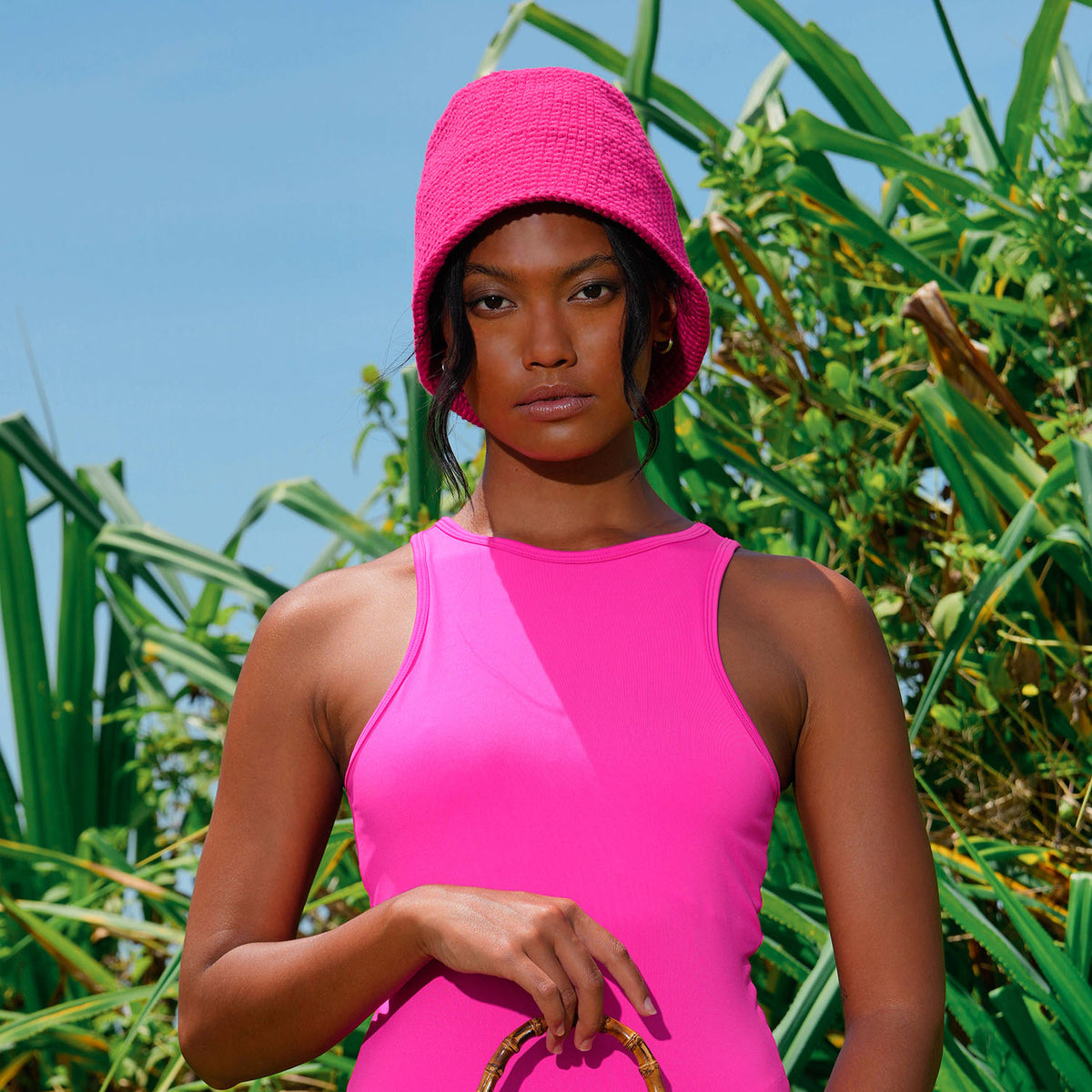 Gani hat in hot pink is hand-crocheted in breathable cotton yarn by our local artisans in Java island. Featuring a modern twist of the cloche hat shape, this hat has sturdy textures and fluid proportions. Fold the brim part to shape it into a sailor hat style.