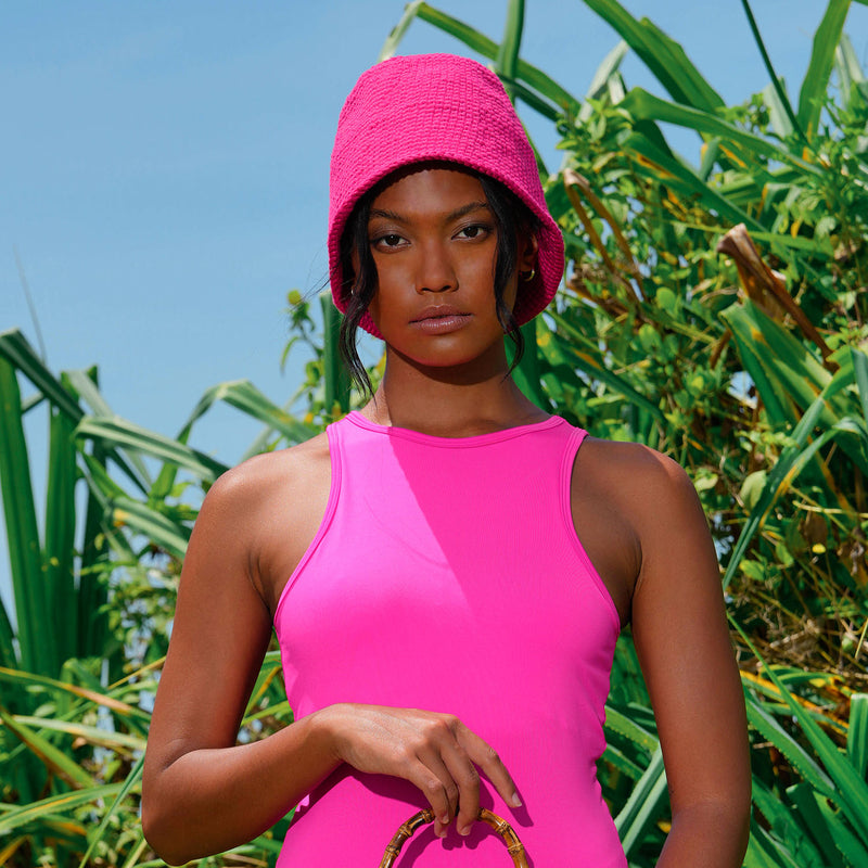 Gani hat in hot pink is hand-crocheted in breathable cotton yarn by our local artisans in Java island. Featuring a modern twist of the cloche hat shape, this hat has sturdy textures and fluid proportions. Fold the brim part to shape it into a sailor hat style.