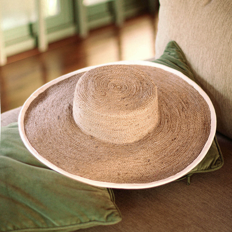 Inka Williams wears BrunnaCo's Beige Lolo Jute Hat in a Bali photoshoot. Handwoven by Balinese artisans, this piece beautifully combines sustainable craftsmanship with the effortless charm of California style.