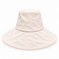 A light cream-colored wide-brim packable canvas sun hat with a soft, plush texture, shown against a plain white background.