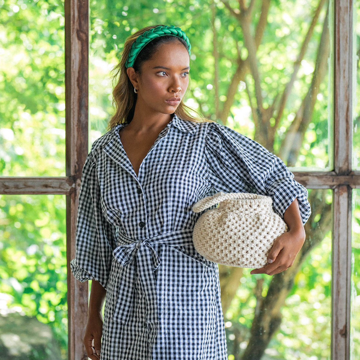 Naga Macrame Beach Bucket Bag. A stylish and eco-friendly macrame beach bag by BrunnaCo, featuring intricate woven patterns, durable handles, and spacious interior, perfect for carrying your beach essentials in sustainable style