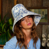 Inka Williams wears BrunnaCo's Nau Botanica Hat in a Bali photoshoot. Handcrafted from upcycled deadstock cotton, this hat merges sustainable craftsmanship with effortless California flair. The adorable princess blue color is a nod to Meghan Markle's As Ever dress, a great way to start spring season.