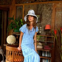 Inka Williams wears BrunnaCo's Nau Botanica Hat in a Bali photoshoot. Handcrafted from upcycled deadstock cotton, this hat merges sustainable craftsmanship with effortless California flair. The adorable princess blue color is a nod to Meghan Markle's As Ever dress, a great way to start spring season.