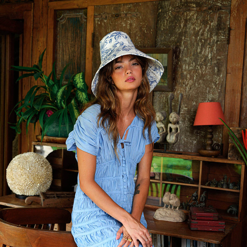 Inka Williams wears BrunnaCo's Nau Botanica Hat in a Bali photoshoot. Handcrafted from upcycled deadstock cotton, this hat merges sustainable craftsmanship with effortless California flair. The adorable princess blue color is a nod to Meghan Markle's As Ever dress, a great way to start spring season.