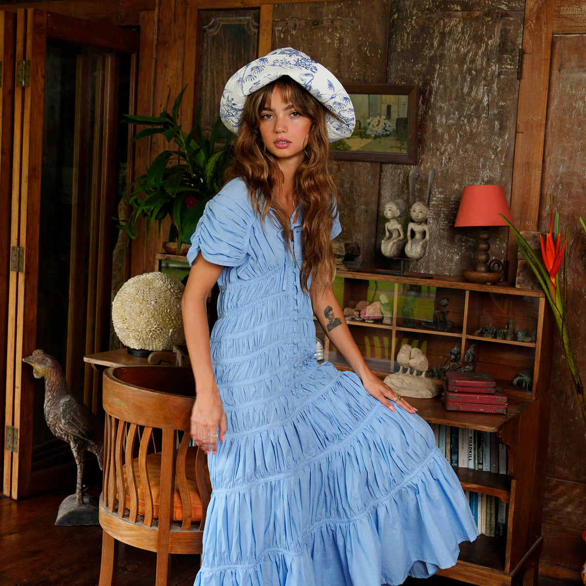 Inka Williams wears BrunnaCo's Nau Botanica Hat in a Bali photoshoot. Handcrafted from upcycled deadstock cotton, this hat merges sustainable craftsmanship with effortless California flair. The adorable princess blue color is a nod to Meghan Markle's As Ever dress, a great way to start spring season.