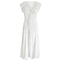 White embroidered vacation dress with ruffled sleeves on a white background