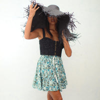 SEKAR Floral Batik Shorts in Sea blue  is made entirely from a relaxed, lightweight cotton fabric fit for every warm-weather destination. With the drawstring waist, wear SEKAR both low and high-rise. As seen on our lookbook, style SEKAR with our MARIGOLD Hand-embroidered Bralette Top and AMORA Frayed Straw Hat.