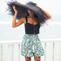 SEKAR Floral Batik Shorts in Sea blue  is made entirely from a relaxed, lightweight cotton fabric fit for every warm-weather destination. With the drawstring waist, wear SEKAR both low and high-rise. As seen on our lookbook, style SEKAR with our MARIGOLD Hand-embroidered Bralette Top and AMORA Frayed Straw Hat.
