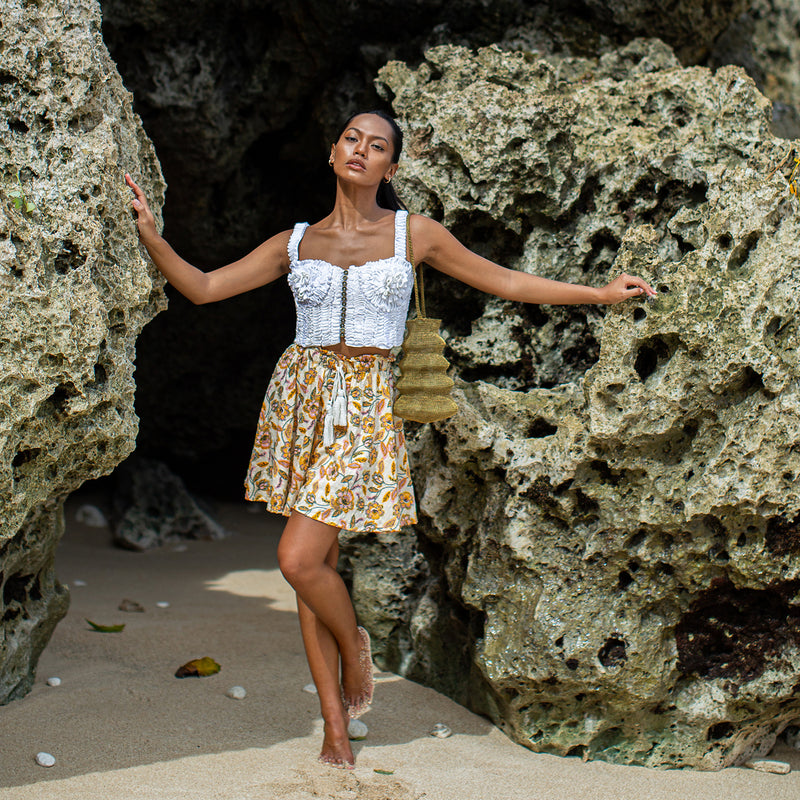 SEKAR Floral Batik Shorts is made entirely from a relaxed, lightweight cotton fabric fit for every warm-weather destination. With the drawstring waist, wear SEKAR both low and high-rise. As seen on our lookbook, style SEKAR with our MARIGOLD Hand-embroidered Bralette Top.