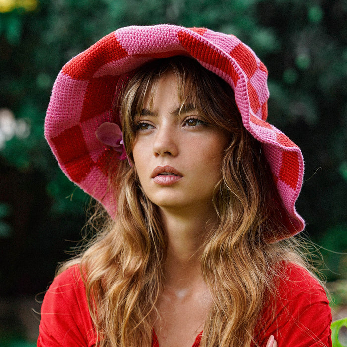 Inka Williams wears BrunnaCo's Shilo Crochet Checkered Hat in a Bali photoshoot. Handwoven by Balinese artisans, this piece seamlessly blends sustainable craftsmanship with laid-back California charm.