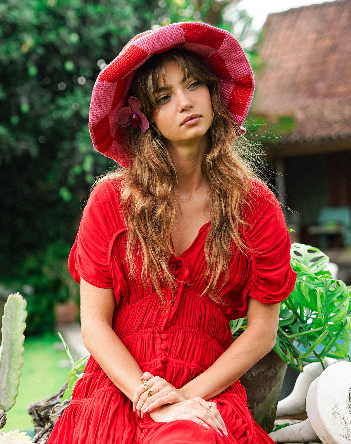 Inka Williams wears BrunnaCo's Shilo Crochet Checkered Hat in a Bali photoshoot. Handwoven by Balinese artisans, this piece seamlessly blends sustainable craftsmanship with laid-back California charm.