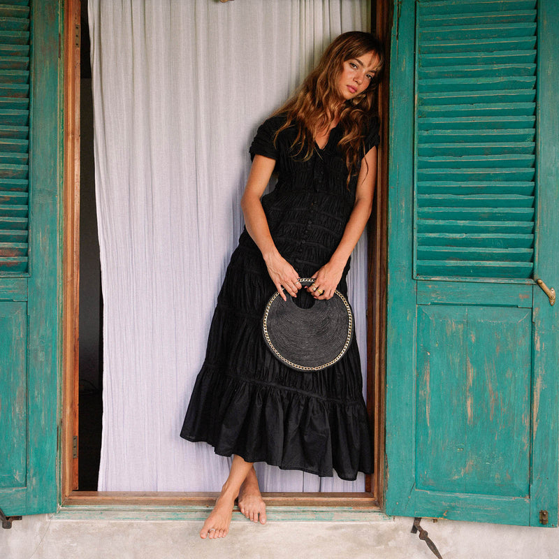 Inka Williams carries BrunnaCo's Black Solo Fig Jute Bag in small size, during a Bali photoshoot. Handwoven by Balinese artisans, this timeless piece embodies effortless California flair.