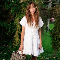 Inka Williams is wearing BrunnaCo's White Lotus Srikandi Resort Ruffle Dress in a beautiful lush green desa home in Bali