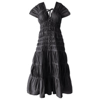 Inka Williams is wearing BrunnaCo's Black Srikandi Ruffle Dress in a photoshoot in Bali. The dress is handmade by artisans in Bali, designed with Californian flair.