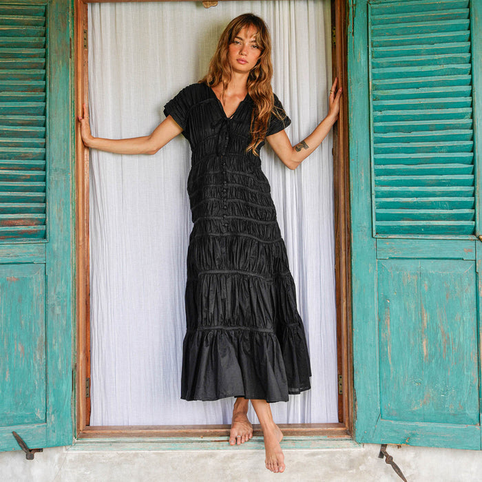 Inka Williams is wearing BrunnaCo's Black Srikandi Ruffle Dress in a photoshoot in Bali. The dress is handmade by artisans in Bali, designed with Californian flair.