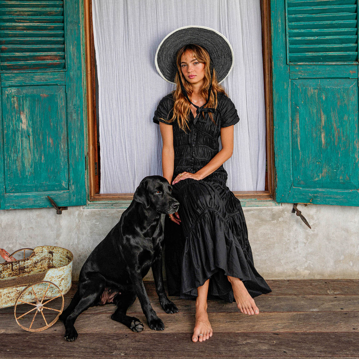 Inka Williams is wearing BrunnaCo's Black Srikandi Ruffle Dress in a photoshoot in Bali. The dress is handmade by artisans in Bali, designed with Californian flair.