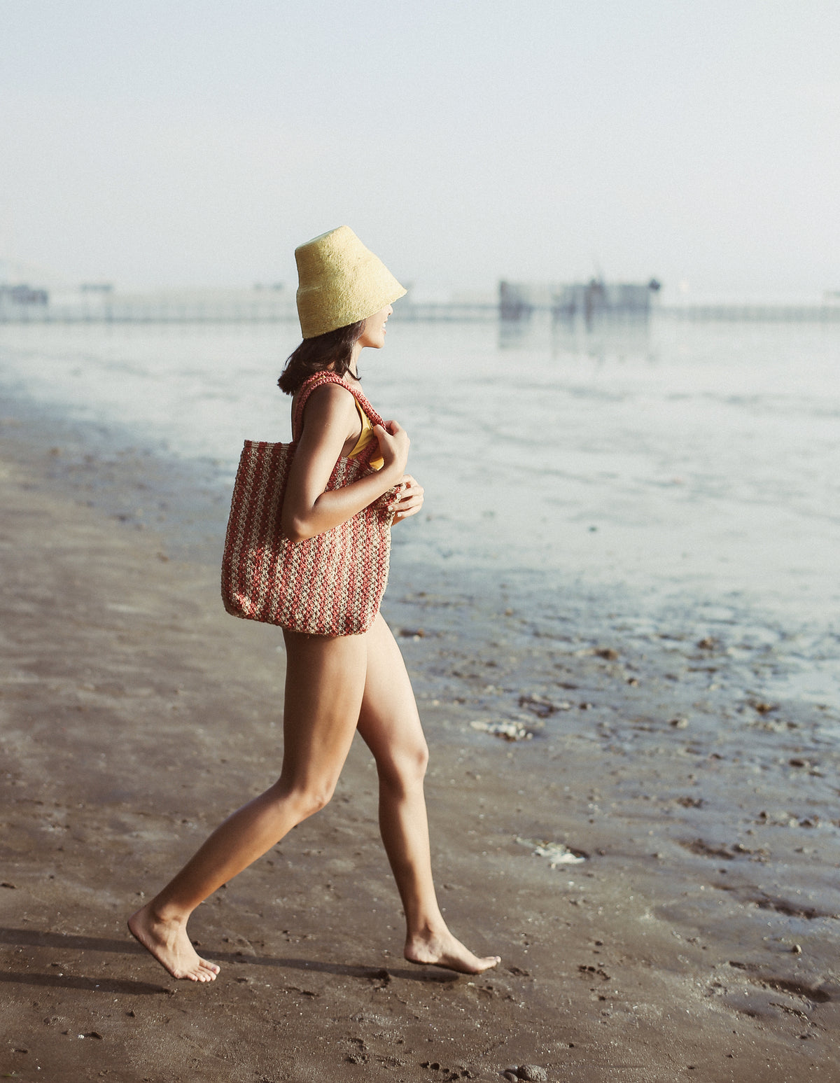 BrunnaCo Louisa Jute Tote Beach Bag. This beautiful striped tote bag in red and beige is handmade by artisans in Bali