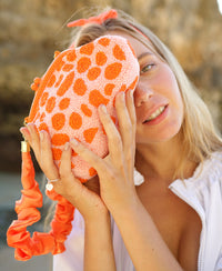 Arnoldi Peachpuff Orange Beaded Polka dot clutch bag with ruffles handle