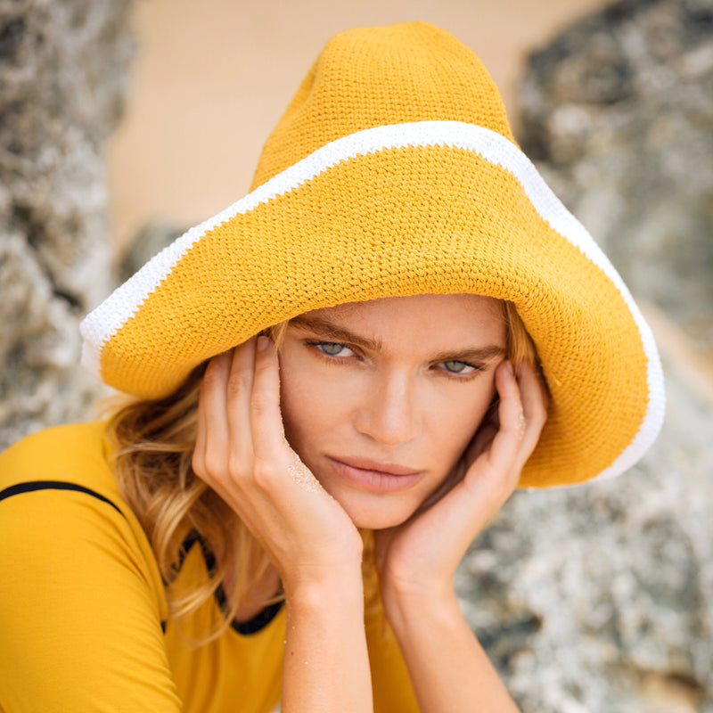 Bloom Line Handmade Crochet hat in Butter Yellow: Soft and shapeable crochet hat inspired by the classic Calla Lily flower shape. Meticulously made by artisans in the villages of Bali. Its light and semi-floppy construction make it the perfect hat for picnics at the beach or poolside any season of the year.