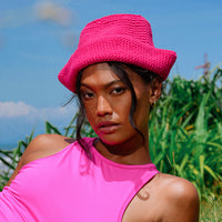 Gani hat in hot pink is hand-crocheted in breathable cotton yarn by our local artisans in Java island. Featuring a modern twist of the cloche hat shape, this hat has sturdy textures and fluid proportions. Fold the brim part to shape it into a sailor hat style.