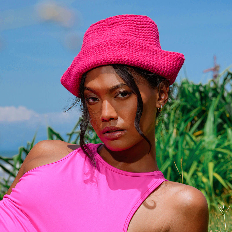 Gani hat in hot pink is hand-crocheted in breathable cotton yarn by our local artisans in Java island. Featuring a modern twist of the cloche hat shape, this hat has sturdy textures and fluid proportions. Fold the brim part to shape it into a sailor hat style.