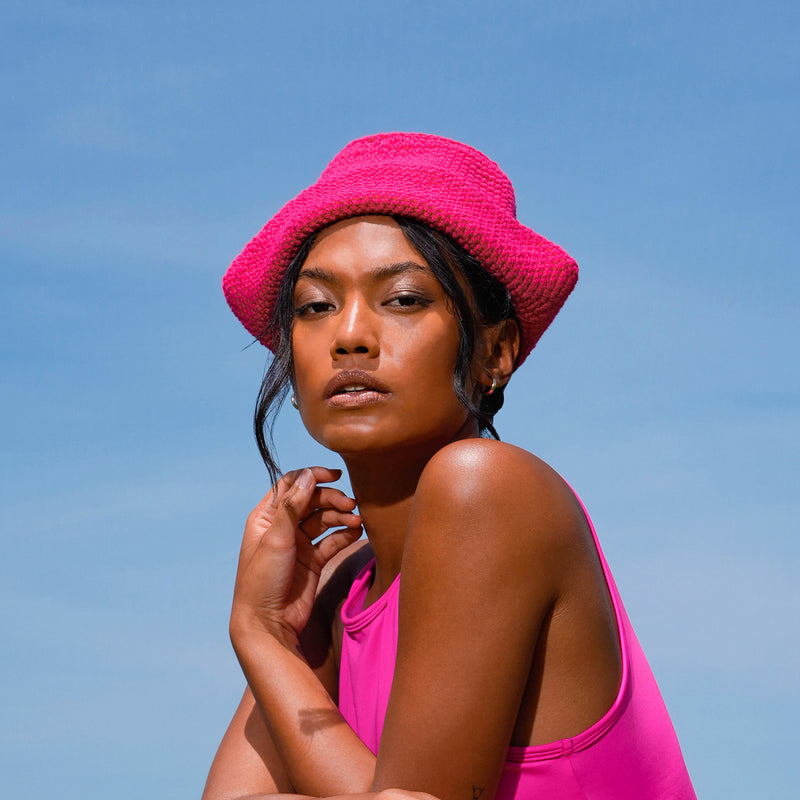 Gani hat in hot pink is hand-crocheted in breathable cotton yarn by our local artisans in Java island. Featuring a modern twist of the cloche hat shape, this hat has sturdy textures and fluid proportions. Fold the brim part to shape it into a sailor hat style.