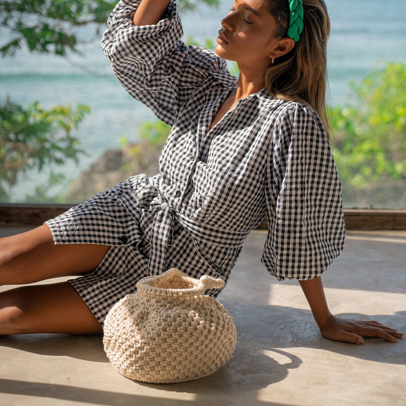 Naga Macrame Beach Bucket Bag. A stylish and eco-friendly macrame beach bag by BrunnaCo, featuring intricate woven patterns, durable handles, and spacious interior, perfect for carrying your beach essentials in sustainable style
