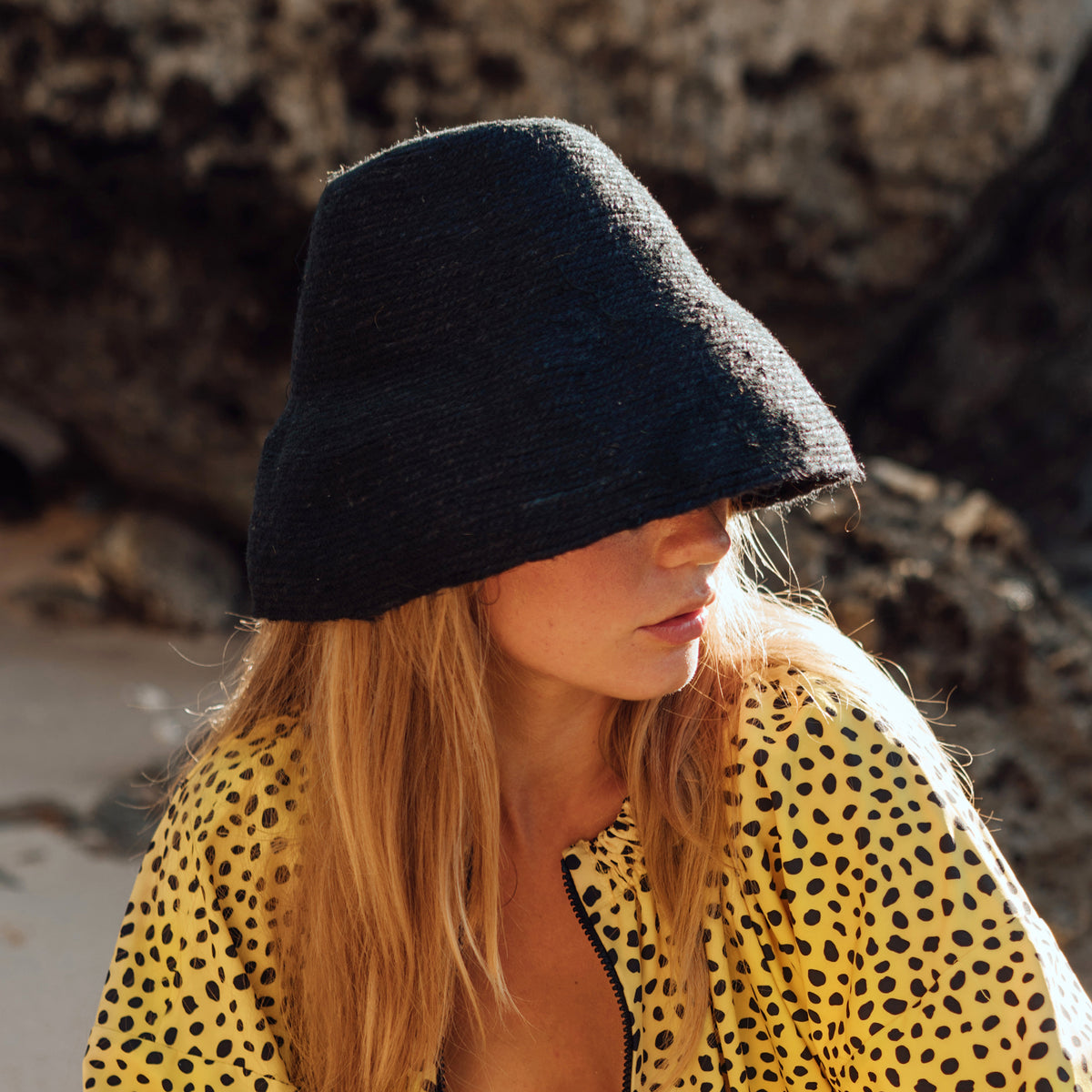 Naomi Jute Bucket Hat in black is designed specifically for the wild at heart with classic sophistication. Enjoy lounging poolside or exploring the city on sun-soaked days as its protective hat brim provides ample shade. Made of natural jute straws which have the perfect weight, this hat will sit comfortably and won't fly away in sudden gusts. It's also very practical to pack in any size luggages and ideal to take on any trips.