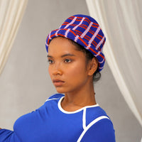 Sorority Plaid Crochet Hat. Hand-crocheted by female artisans in Java, Indonesia, SORORITY plaid crochet hat is a reminder of the beautiful feeling of being outdoors. Its fresh blue and energetic red color invites us to celebrate the seasons in the sun.