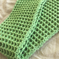 BrunnaCo's WAFFLE Crochet Scarf in sage green has a cozy and buttery-soft texture that makes you want to wear it everywhere when the temperature gets cold. It's hand-crocheted in waffle pattern with sumptuous cotton yarn by our female artisans in Java who put so much love into this piece. Wrap it around your neck twice or let it drape loosely over the lapels of your coat.