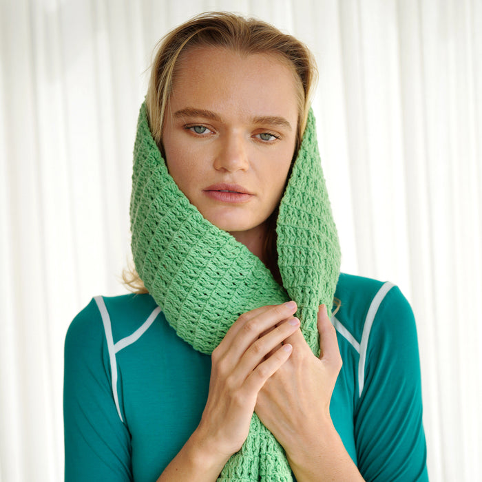 BrunnaCo's WAFFLE Crochet Scarf in sage green has a cozy and buttery-soft texture that makes you want to wear it everywhere when the temperature gets cold. It's hand-crocheted in waffle pattern with sumptuous cotton yarn by our female artisans in Java who put so much love into this piece. Wrap it around your neck twice or let it drape loosely over the lapels of your coat.